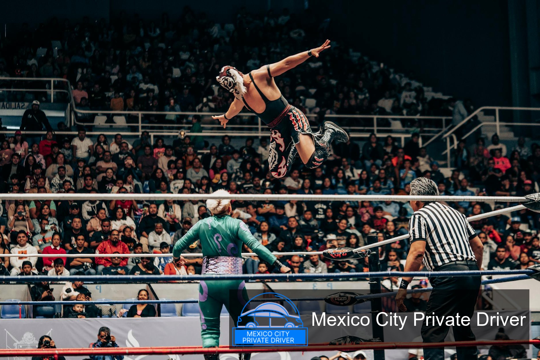 Colorful masks and costumes of Lucha Libre wrestlers in the ring at Arena México, Mexico City.