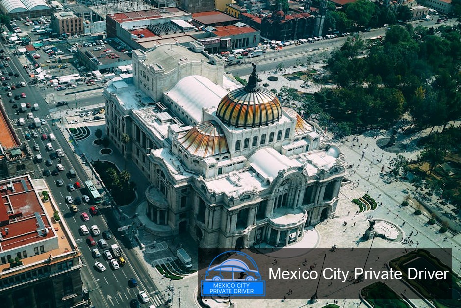 The intricate stained glass dome of Palacio de Bellas Artes, showcasing vibrant colors and artistic designs.