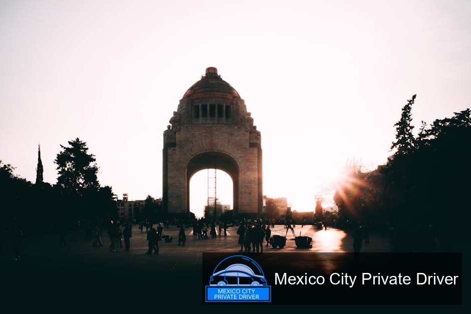 The Monumento a la Revolución stands tall against a twilight sky, its dome glowing with warm lights.