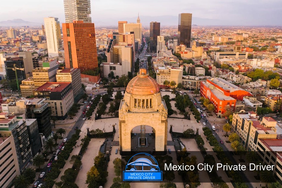 The striking silhouette of the Monumento a la Revolución against a vibrant sunset sky, highlighting its architectural details.