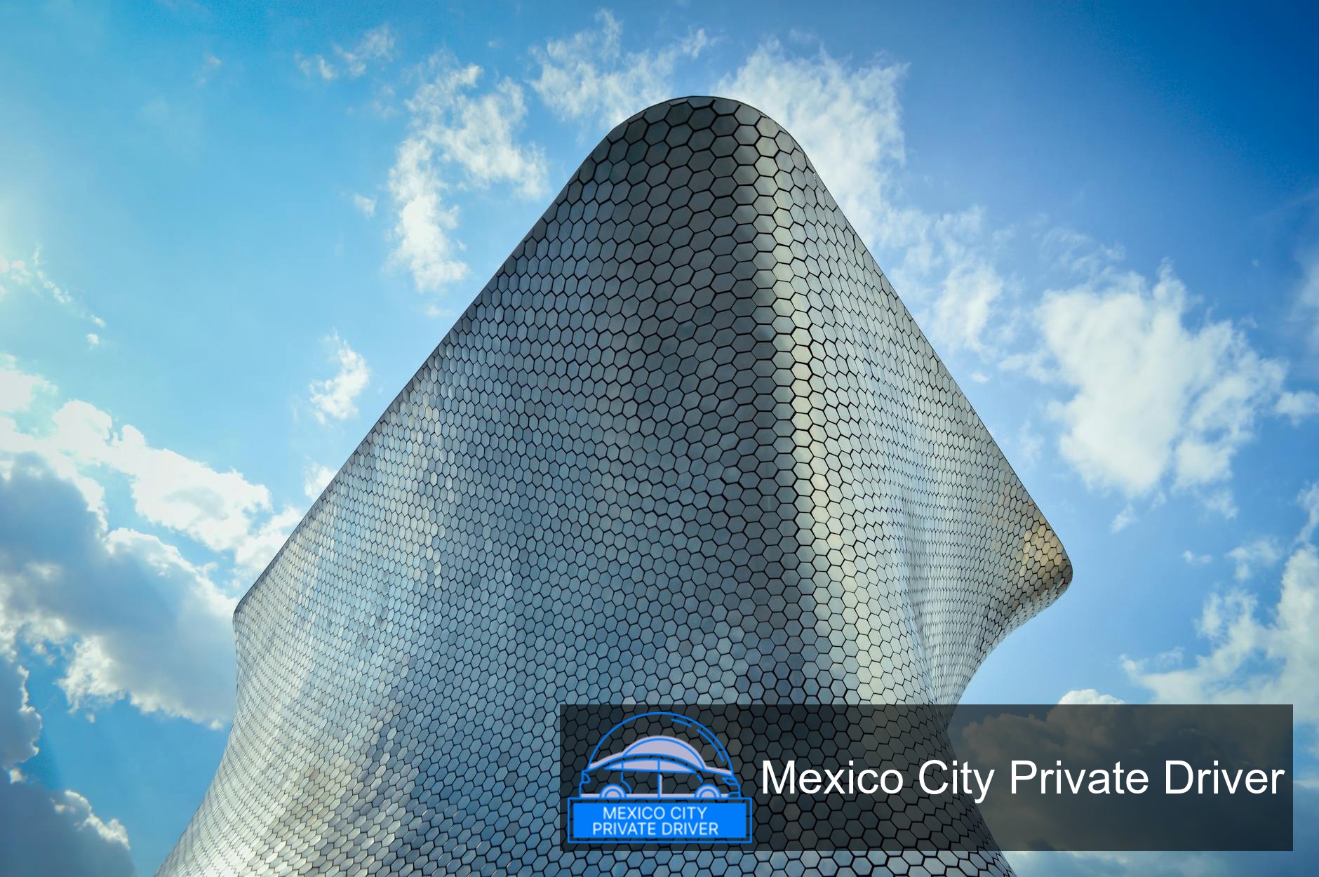 The striking silver façade of Museo Soumaya reflecting the sky in Mexico City.