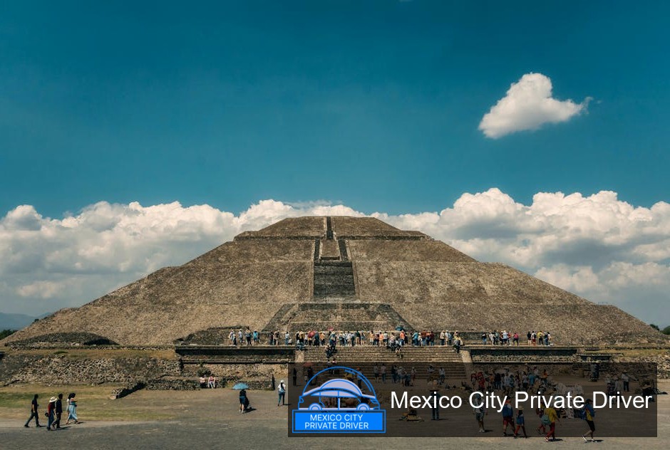The Pyramid of the Sun rises majestically against a clear blue sky, surrounded by lush greenery at Teotihuacán.