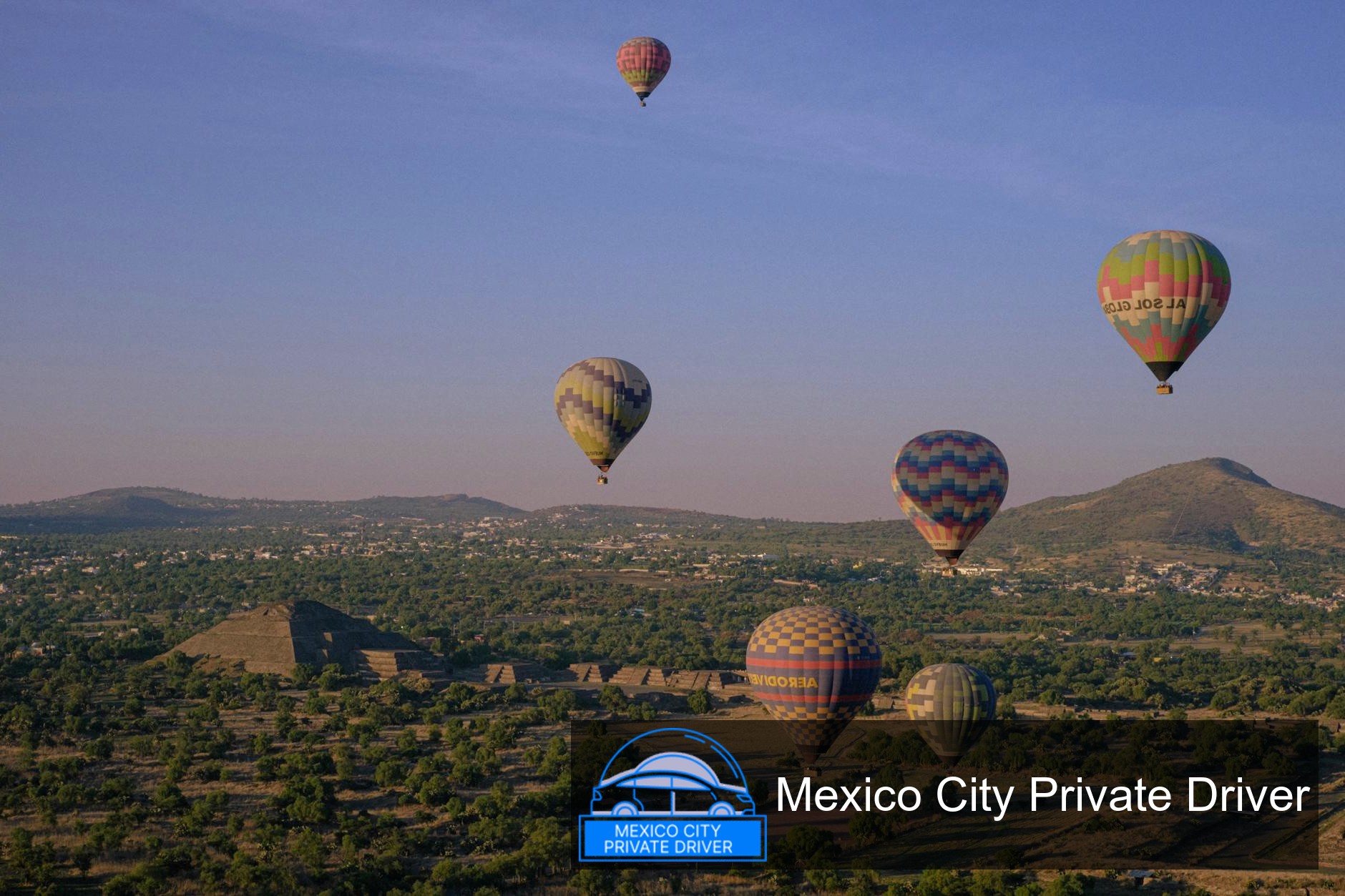 The Pyramid of the Sun towering against a clear blue sky, surrounded by ancient ruins at Teotihuacán.