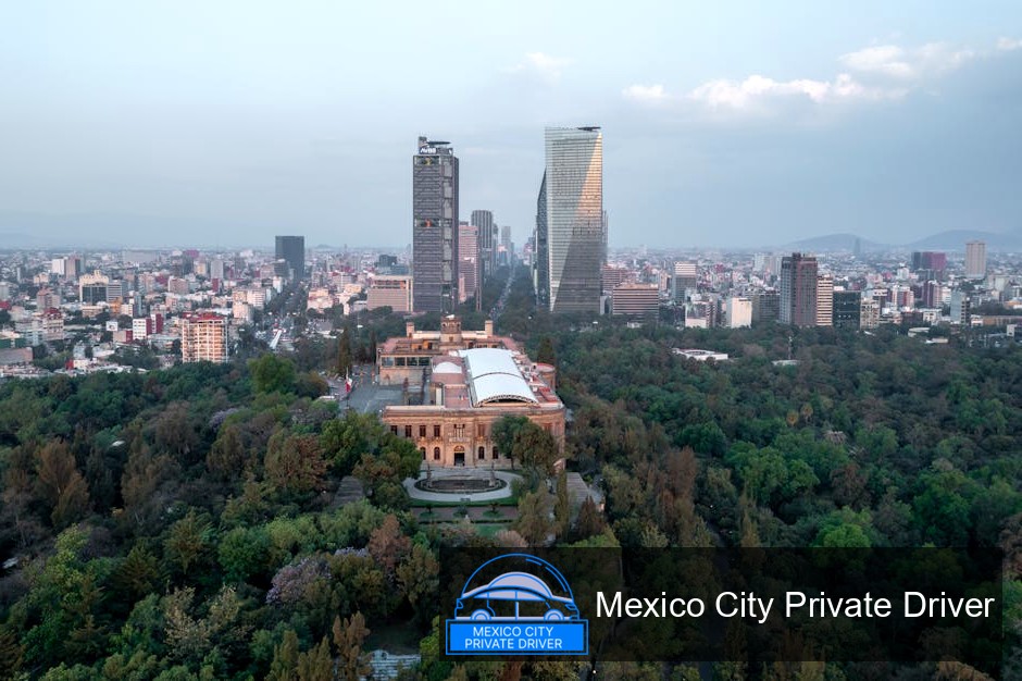 Vibrant green landscape of Chapultepec Park with historic monuments visible in the distance.